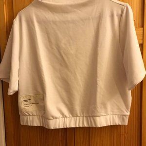 Brand new. Women's crop top Reebok top.